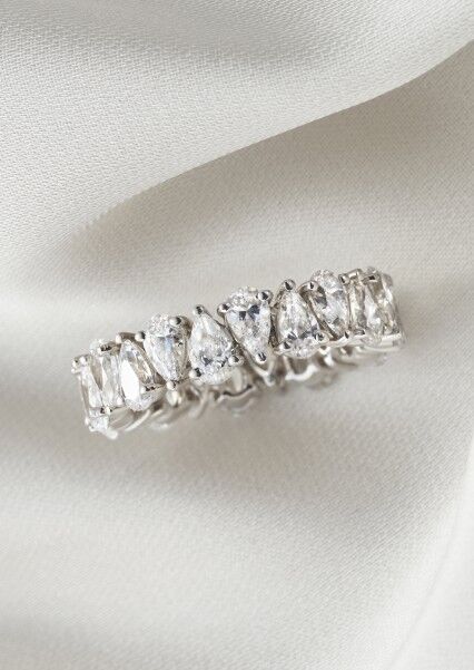 Platinum engagement ring with 0.74ct oval diamond with side