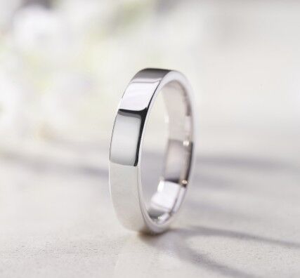 Platinum engagement ring with 0.74ct oval diamond with side